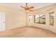 Bright bedroom with ceiling fan and large window at 13820 W Cheery Lynn Rd, Avondale, AZ 85392