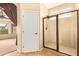 Bathroom with shower and access to bedroom at 13820 W Cheery Lynn Rd, Avondale, AZ 85392