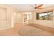 Bright living room with ceiling fan and view to backyard at 13820 W Cheery Lynn Rd, Avondale, AZ 85392