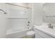 Clean bathroom with a bathtub, shower, and white tile at 17815 W Blue Sky Dr, Surprise, AZ 85387