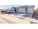 New construction home with a two-car garage and landscaped front yard at 17815 W Blue Sky Dr, Surprise, AZ 85387