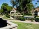 Community pond with lush landscaping and walking path nearby at 10015 E Mountain View Rd # 2011, Scottsdale, AZ 85258