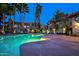 Inviting community pool area with comfortable lounge chairs and palm trees at 10015 E Mountain View Rd # 2011, Scottsdale, AZ 85258