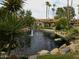 Serene community pond with fountains and palm trees at 10015 E Mountain View Rd # 2011, Scottsdale, AZ 85258