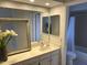 Elegant bathroom with a double vanity, large mirror, and bathtub at 10015 E Mountain View Rd # 2011, Scottsdale, AZ 85258