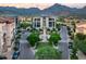 Aerial view of community with a central plaza and surrounding buildings at 18720 N 101St St # 2006, Scottsdale, AZ 85255