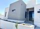 Modern home's front entrance with gray and white exterior at 27222 N 64Th Dr, Phoenix, AZ 85083