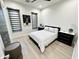 Bedroom with queen bed, wood floors, and deer art at 27222 N 64Th Dr, Phoenix, AZ 85083