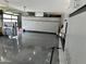 Organized garage with epoxy flooring and storage at 27222 N 64Th Dr, Phoenix, AZ 85083