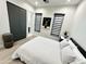 Bedroom with queen bed, wood floors, and deer art at 27222 N 64Th Dr, Phoenix, AZ 85083