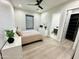 Bedroom with queen bed, ensuite bath, and walk-in closet at 27222 N 64Th Dr, Phoenix, AZ 85083