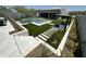Modern backyard with putting green, pool, spa, and outdoor kitchen at 27222 N 64Th Dr, Phoenix, AZ 85083