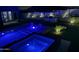 Luxury pool and spa with LED lighting at night at 27222 N 64Th Dr, Phoenix, AZ 85083