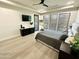 Luxury bedroom with a king bed and large windows at 27222 N 64Th Dr, Phoenix, AZ 85083