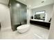 Modern bathroom with soaking tub and unique tile at 27222 N 64Th Dr, Phoenix, AZ 85083