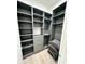 Large walk-in closet with ample shelving and hanging space at 27222 N 64Th Dr, Phoenix, AZ 85083