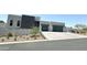 Modern home exterior with two-car garage and landscaping at 27222 N 64Th Dr, Phoenix, AZ 85083