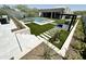 Luxury backyard oasis with a sparkling pool, spa, outdoor kitchen, putting green, and expansive patio at 27222 N 64Th Dr, Phoenix, AZ 85083