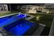 Relaxing spa and inviting pool with blue LED lighting at night at 27222 N 64Th Dr, Phoenix, AZ 85083