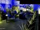 Relaxing patio furniture with fire pit at night at 27222 N 64Th Dr, Phoenix, AZ 85083