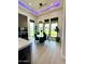 Modern dining area with a round table and six chairs, offering views of the backyard at 27222 N 64Th Dr, Phoenix, AZ 85083