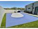 Private backyard basketball court with artificial turf and surrounding landscaping at 27222 N 64Th Dr, Phoenix, AZ 85083