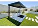 Covered outdoor kitchen with built-in grill and expansive countertop at 27222 N 64Th Dr, Phoenix, AZ 85083