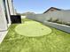 Landscaped backyard putting green with artificial turf at 27222 N 64Th Dr, Phoenix, AZ 85083
