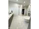Bright bathroom with a soaking tub, separate toilet area, and walk-in closet at 27222 N 64Th Dr, Phoenix, AZ 85083