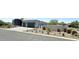 Modern home exterior showcasing landscaping and driveway at 27222 N 64Th Dr, Phoenix, AZ 85083