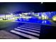 Inviting pool and spa area with night lighting at 27222 N 64Th Dr, Phoenix, AZ 85083