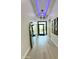 Bright and airy entryway with modern light fixture at 27222 N 64Th Dr, Phoenix, AZ 85083