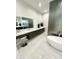 Luxurious bathroom with soaking tub, double vanity, and walk-in shower at 27222 N 64Th Dr, Phoenix, AZ 85083