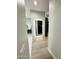 Hallway with lit mirror and view of closet at 27222 N 64Th Dr, Phoenix, AZ 85083