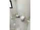 Contemporary bathroom with two toilets and modern wall-mounted fixtures at 27222 N 64Th Dr, Phoenix, AZ 85083