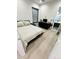 Light bedroom with a queen bed and ensuite bathroom access at 27222 N 64Th Dr, Phoenix, AZ 85083