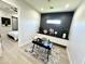 Home office with built-in desk and view to bedroom at 27222 N 64Th Dr, Phoenix, AZ 85083