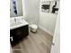 Modern powder room with floating vanity and toilet at 27222 N 64Th Dr, Phoenix, AZ 85083