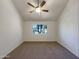 Simple bedroom with large window and neutral wall colors at 7417 N Via Camello Del Norte -- # 160, Scottsdale, AZ 85258