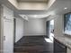 Bright dining area with dark laminate floors and access to patio at 7417 N Via Camello Del Norte -- # 160, Scottsdale, AZ 85258