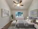 Cozy bedroom with a large window, ceiling fan, and staged bed at 7417 N Via Camello Del Norte -- # 160, Scottsdale, AZ 85258