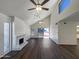 Living room with vaulted ceilings, fireplace, and sliding glass doors at 7417 N Via Camello Del Norte -- # 160, Scottsdale, AZ 85258
