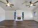 Spacious living room featuring a fireplace and dark laminate flooring at 7417 N Via Camello Del Norte -- # 160, Scottsdale, AZ 85258