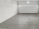 Attached garage with open door and concrete floor at 2150 W Alameda Rd # 1250, Phoenix, AZ 85085