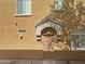 Tan colored building exterior with arched entryway at 2150 W Alameda Rd # 1250, Phoenix, AZ 85085