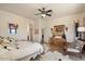 Spacious main bedroom with ensuite bathroom and southwestern decor at 43908 N 10Th St, New River, AZ 85087