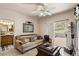 Cozy living room with access to patio, southwestern decor, and mountain views at 43908 N 10Th St, New River, AZ 85087