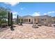 Landscaped backyard with fire pit and flagstone patio at 43908 N 10Th St, New River, AZ 85087