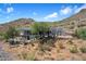 Aerial view showcasing a house's desert setting and mountain backdrop at 43908 N 10Th St, New River, AZ 85087