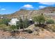 Aerial view of a house nestled in a desert landscape with mountain views at 43908 N 10Th St, New River, AZ 85087